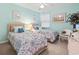 Inviting bedroom with two twin beds, soft decor, and ample natural light at 9550 Dunes Gable Dr. # A, Myrtle Beach, SC 29572