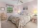 Cozy bedroom featuring a queen bed, soft lighting, and a serene coastal-themed decor at 9550 Dunes Gable Dr. # A, Myrtle Beach, SC 29572