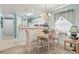 Bright dining area with views into the kitchen is illuminated by natural light and a decorative chandelier at 9550 Dunes Gable Dr. # A, Myrtle Beach, SC 29572