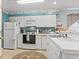 Well-lit kitchen features classic appliances and generous counter space at 9550 Dunes Gable Dr. # A, Myrtle Beach, SC 29572