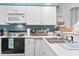 Well-lit kitchen features classic appliances and generous counter space at 9550 Dunes Gable Dr. # A, Myrtle Beach, SC 29572
