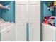 Laundry area with side-by-side washer and dryer and storage shelf at 9550 Dunes Gable Dr. # A, Myrtle Beach, SC 29572