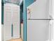 Adjacent to refrigerator are bi-fold doors to laundry area with appliances at 9550 Dunes Gable Dr. # A, Myrtle Beach, SC 29572