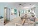 Inviting living room boasts light-blue walls, a ceiling fan, and an open view to the kitchen and dining area at 9550 Dunes Gable Dr. # A, Myrtle Beach, SC 29572