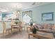 Light-filled living space connects dining area with views into kitchen, complete with ceiling fan at 9550 Dunes Gable Dr. # A, Myrtle Beach, SC 29572