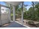 Screened-in patio offering a peaceful view of the backyard, perfect for relaxation at 9550 Dunes Gable Dr. # A, Myrtle Beach, SC 29572
