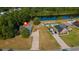 Aerial view of a home with a long driveway and mature trees near a pond at 101 Alpharetta Ct., Conway, SC 29526