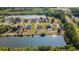 Aerial view of homes backing to pond with swimming pools and lush green surroundings at 101 Alpharetta Ct., Conway, SC 29526