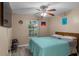 Serene bedroom with a ceiling fan, large window, and relaxing decor, creating a peaceful retreat at 101 Alpharetta Ct., Conway, SC 29526