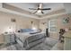 Inviting bedroom boasts a tray ceiling, ceiling fan, and cozy furnishings for ultimate relaxation at 101 Alpharetta Ct., Conway, SC 29526