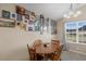 Cozy dining area bathed in natural light, featuring a wood table and custom picture gallery wall at 101 Alpharetta Ct., Conway, SC 29526