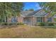 Charming brick home with well-maintained landscaping and inviting curb appeal, showcasing its classic design elements at 101 Alpharetta Ct., Conway, SC 29526