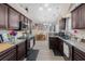 Spacious kitchen featuring granite countertops, dark cabinetry, and a dining area, creating a welcoming space at 101 Alpharetta Ct., Conway, SC 29526