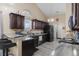 Modern kitchen with granite countertops, stainless steel appliances, and ample cabinet space, perfect for cooking at 101 Alpharetta Ct., Conway, SC 29526
