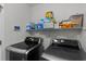 Convenient laundry area featuring modern, front-loading washer and dryer, plus ample shelving for storage at 101 Alpharetta Ct., Conway, SC 29526