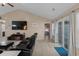 Comfortable living room with an entertainment center, a plush seating arrangement, and sliding glass door at 101 Alpharetta Ct., Conway, SC 29526