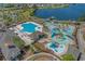 Aerial view of a community resort featuring swimming pools, waterslides and outdoor seating at 101 Fulbourn Pl., Myrtle Beach, SC 29579