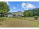 Spacious backyard with a black metal fence enclosing the property and mature trees at 101 Fulbourn Pl., Myrtle Beach, SC 29579