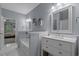 Bathroom features a double vanity, a separate tub, modern finishes and an open doorway to the main bedroom at 101 Fulbourn Pl., Myrtle Beach, SC 29579