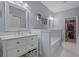 Well-lit bathroom features a double vanity, a separate tub, a walk-in closet, and modern finishes at 101 Fulbourn Pl., Myrtle Beach, SC 29579