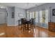 Dining room featuring hardwood floors, modern light fixture and large window at 101 Fulbourn Pl., Myrtle Beach, SC 29579