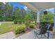 Cozy front porch with comfortable seating and well-maintained landscaping, ideal for enjoying the outdoors at 101 Fulbourn Pl., Myrtle Beach, SC 29579