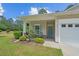 Inviting front porch with a seating area, perfect for relaxing and enjoying the outdoors at 101 Fulbourn Pl., Myrtle Beach, SC 29579