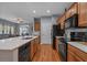 Modern kitchen with stainless steel appliances, hardwood floors, and island with seating at 101 Fulbourn Pl., Myrtle Beach, SC 29579