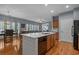 Bright kitchen with large island, hardwood floors, stainless appliances, and open layout at 101 Fulbourn Pl., Myrtle Beach, SC 29579