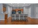 Open kitchen with island seating, stainless steel appliances, and hardwood floors at 101 Fulbourn Pl., Myrtle Beach, SC 29579