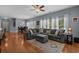 Spacious living room with hardwood floors, sectional sofa, and view to the dining area at 101 Fulbourn Pl., Myrtle Beach, SC 29579