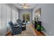 Bright sun room with comfortable seating, hardwood floors, and access to the backyard at 101 Fulbourn Pl., Myrtle Beach, SC 29579