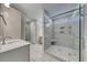 Modern bathroom with a glass-enclosed shower, tiled walls, built-in shelves, and a vanity at 1055 Laconic Dr., Myrtle Beach, SC 29588