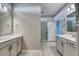 Spacious bathroom featuring double vanities with framed mirrors and access to a tiled shower at 1055 Laconic Dr., Myrtle Beach, SC 29588