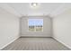 Neutral bedroom featuring a window with natural light and plush carpeting at 1055 Laconic Dr., Myrtle Beach, SC 29588