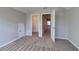 Bright bedroom with neutral walls, carpet, and access to a closet and other parts of the house at 1055 Laconic Dr., Myrtle Beach, SC 29588