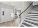 Welcoming entryway features hardwood floors, a staircase, and a bright, airy feel at 1055 Laconic Dr., Myrtle Beach, SC 29588