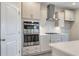 Well-equipped kitchen with built-in oven, stainless steel appliances, and stylish white cabinetry at 1055 Laconic Dr., Myrtle Beach, SC 29588