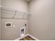 Laundry room featuring wire shelving, wood-look floors, and hookups for a washing machine at 1055 Laconic Dr., Myrtle Beach, SC 29588