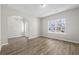 Bright living room with hardwood floors and a large window overlooking the neighborhood at 1055 Laconic Dr., Myrtle Beach, SC 29588
