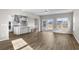 Bright, open living space with hardwood floors, connected to a modern kitchen at 1055 Laconic Dr., Myrtle Beach, SC 29588