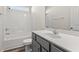 Bright bathroom with a shower/tub combo, toilet, and gray vanity with single white sink at 109 Old Chimney Ln, Conway, SC 29526
