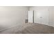 Bedroom with neutral carpeting, double closet, and access to hallway at 109 Old Chimney Ln, Conway, SC 29526