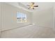 Serene bedroom with neutral carpet and tray ceiling, offering a peaceful retreat at 109 Old Chimney Ln, Conway, SC 29526
