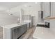 Stylish kitchen showcasing gray cabinetry, stainless steel appliances, and a large island at 109 Old Chimney Ln, Conway, SC 29526