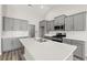 Modern kitchen featuring gray cabinets, quartz countertops, and stainless steel appliances at 109 Old Chimney Ln, Conway, SC 29526