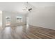 Open-concept living area with hardwood flooring, vaulted ceilings, and abundant light at 109 Old Chimney Ln, Conway, SC 29526