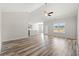 Spacious living room with hardwood floors, high ceilings, and plenty of natural light at 109 Old Chimney Ln, Conway, SC 29526