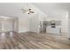 Inviting open-concept space with hardwood floors connecting living and kitchen areas at 109 Old Chimney Ln, Conway, SC 29526