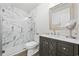 Modern bathroom with glass enclosed shower, marble tile, vanity, and attractive finishes at 1127 Harvester Circle # 1127, Myrtle Beach, SC 29579